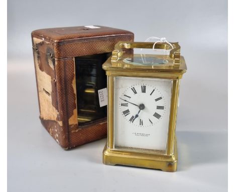 Brass carriage clock with full depth enamel dial marked 'J S Rambridge of Salisbury'. Leather covered fitted case. 12.5cm hig