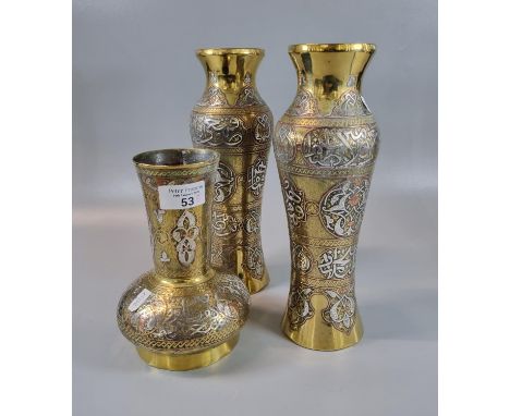 Pair of Islamic design silver inlaid ovoid vases together with a similar Islamic design baluster cylinder neck vase in brass 