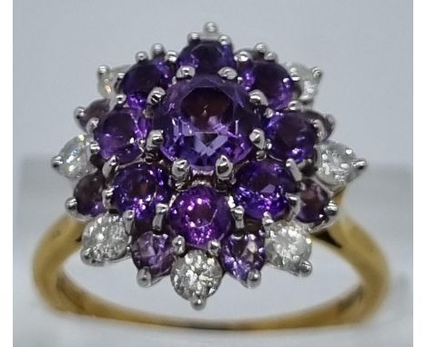 18ct gold diamond and probably tanzanite multi cluster ring comprising a total of eight diamonds.  6g approx.  Size M1/2.  (B