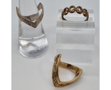 9ct gold ring together with a 9ct gold wishbone ring.  5.3g approx.  Together with a silver wishbone ring.  (3)   (B.P. 21% +