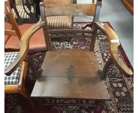 Early 19th century oak bobbin and rail back open farmhouse armchair.    (B.P. 21% + VAT) 
