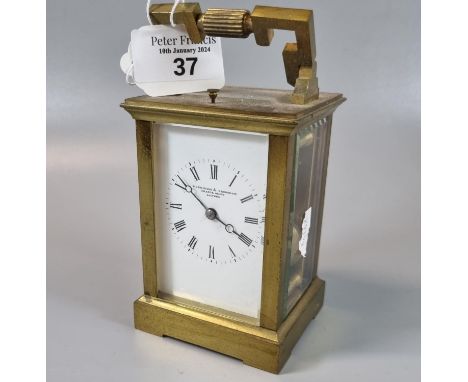 Brass carriage clock, the full depth Roman enamel face marked 'Parkinson & Frodsham, London', with repeating movement, striki
