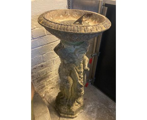 Cast aluminium cherub design pedestal bird bath together with a reconstituted stone figure mounted bird bath and a brass sund