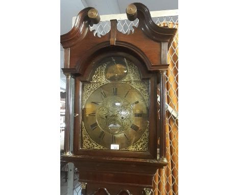 Late 18th century eight day oak longcase clock having broken swan neck pediment above arched aperture flanked by reeded colum