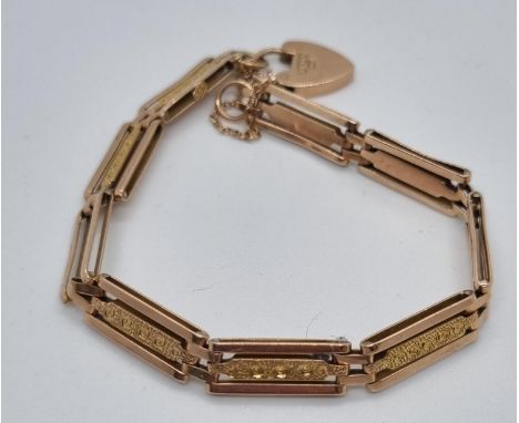9ct rose gold three bar gate bracelet with heart padlock.  11.5g approx.   (B.P. 21% + VAT) 