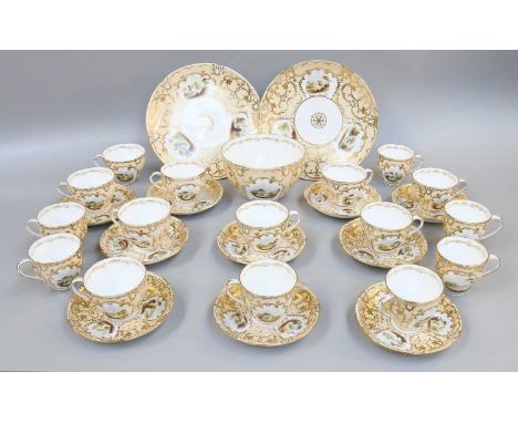 A Victorian Porcelain Tea Service, buff ground with gilt scrollwork and painted with romantic landscapes (qty)