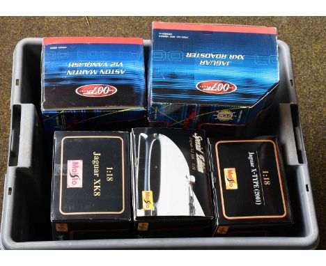 Various 1:18 Scale Diecast: James Bond Aston Martin V12 Vanquish; Maisto Jaguar X-type (2001), Jaguar XJ220 and Jaguar XK8; 1
