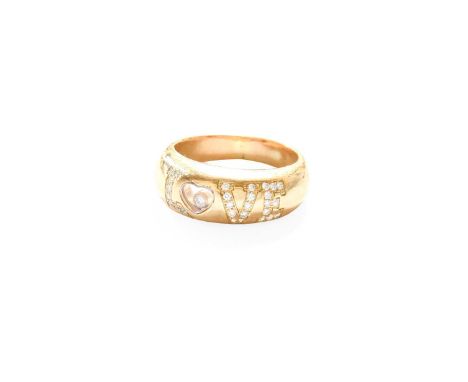 A Diamond Ring, by Chopard, the yellow band pavé set with round brilliant cut diamonds to depict the word LOVE, the 'O' forme