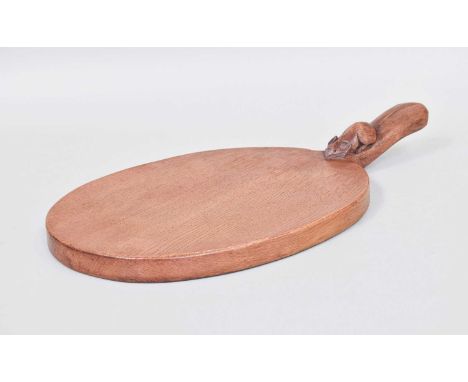 Workshop of Robert Mouseman Thompson (Kilburn): An English Oak Cheese Board, post 1960, of standard form, with carved mouse t