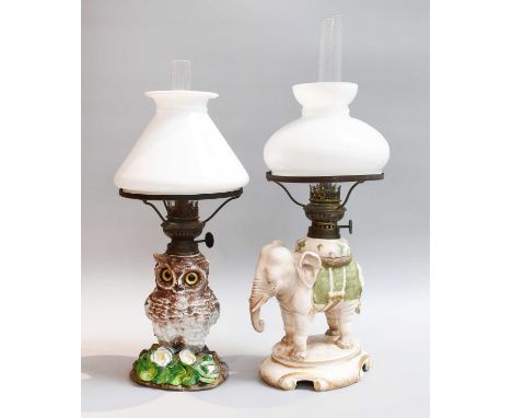 An Alfred Stellmacher Porcelain Nursery Oil Lamp, modelled as an elephant, printed mark, together with another porcelain exam