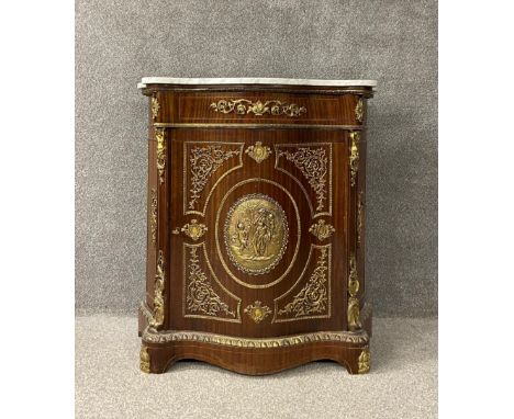 A 19th century style pier cabinet with marble top above shaped panel door with ormolu mounts on plinth base. H.103 W.98.5 D.4