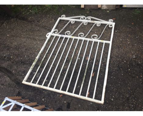 A white painted metal garden gate