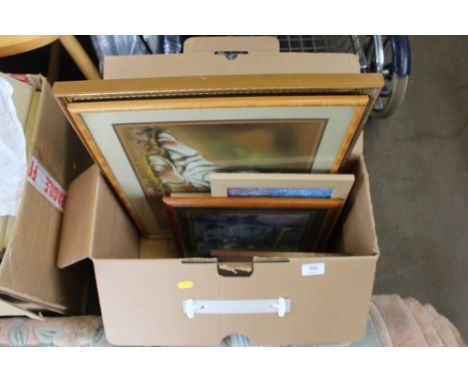 A box of various pictures and prints
