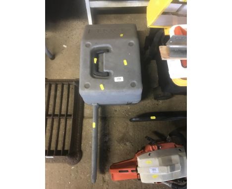 A Ryobi petrol chain saw in carrying case 