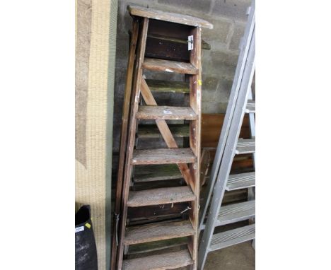 Two wooden step ladders