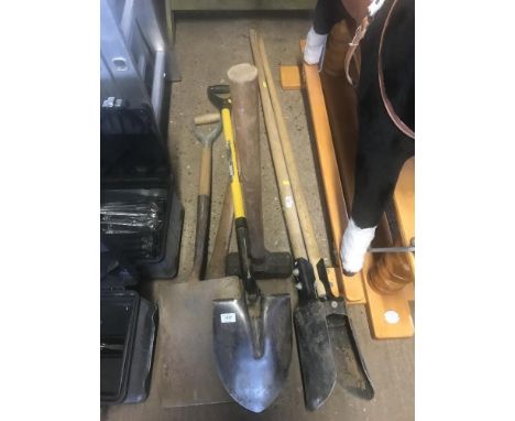 A quantity of long handled tools
