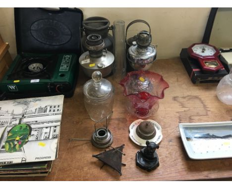 Two oil lamps; cranberry glass light shade; cut glass storage jar; two small churns etc. 