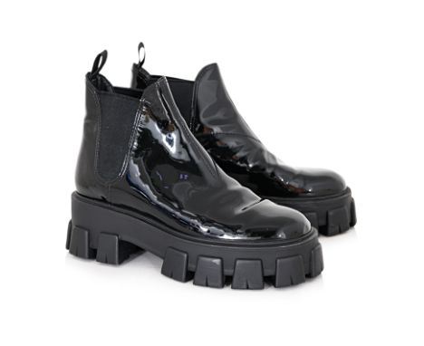 A PAIR OF PRADA MONOLITH PATENT CHELSEA BOOTS
Black leather round toe with elasticated side panels, double pull-tabs at the o