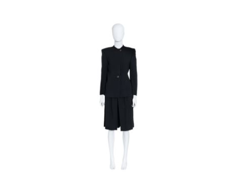 A CHRISTIAN DIOR TRICOTS ET COORDONNÉ ENSEMBLE
Including a structured black jacket with a collarless neckline, two-button clo