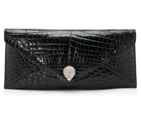 AN ETHAN K BLACK CROCODILE ENVELOPE CLUTCH
Glossy black leather with red interior, hedgehog clasp, has dust bag and vanity ha