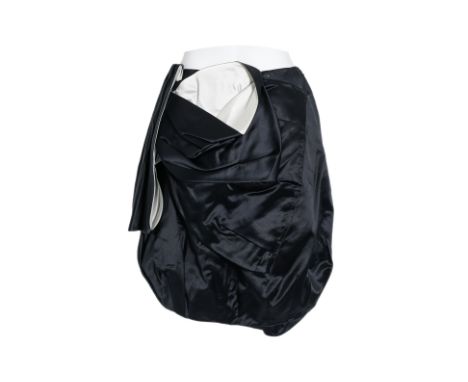 A PRADA BLACK EVENING GATHERED SILK SKIRT
Draped detailing, featuring a gathered silhouette with asymmetrical folds balloon 
