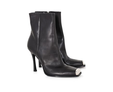 A PAIR OF CALVIN KLEIN 205W39NYC BLACK WILAMIONA BOOTS BY RAF SIMONS
Square toe with a metal toe cap, silver-tone hardware, a