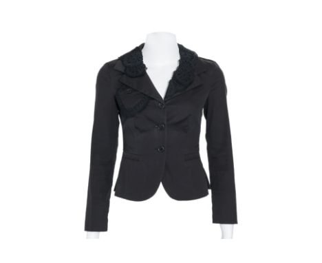 A PRADA LIGHTWEIGHT JACKET WITH FLORAL DETAIL
With a notched lapel, three-button front closure, decorative cutout lace detail