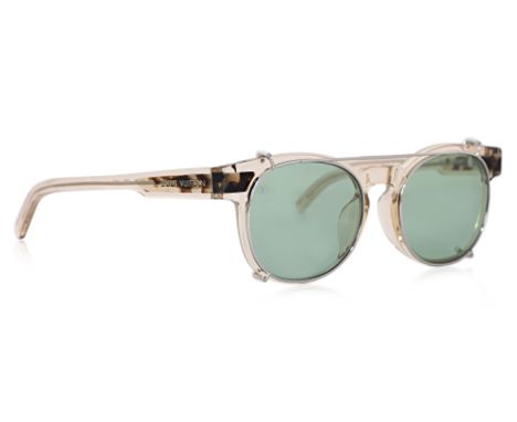 A PAIR OF LOUIS VUITTON JUNGLE SUNGLASSES
Clear acetate frame with tortoise shell detail, accompanied by clip on tinted shade