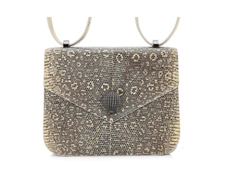 AN ETHAN K BEIGE SNAKESKIN CLUTCH
Snakeskin on leather with beige stitching, black leather interior, hedgehog clasp, with van