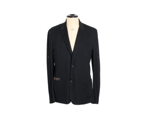 A LOUIS VUITTON BLACK STRETCH TRAVEL JACKET
Unstructured with two front patch pockets, a chest pocket, button accents on slee