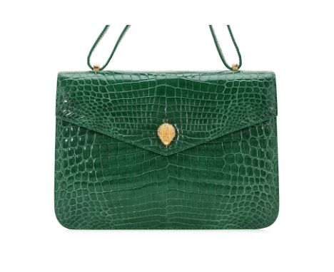 AN ETHAN K CROCODILE LEATHER GREEN HANDBAG
Glossy green leather with green stitching, yellow interior, hedgehog clasp, with v
