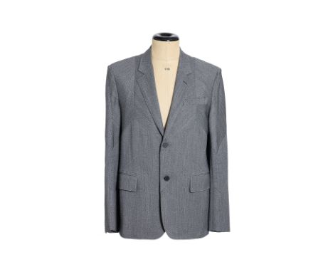 A LOUIS VUITTON GREY SUIT JACKET
Featuring a two-button closure, notched lapels, three front pockets, and distinctive stitche
