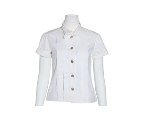 A CHANEL SHORT SLEEVE BLOUSE
Featuring a front pleat design, rounded collar with a decorative bow, and large decorative butto