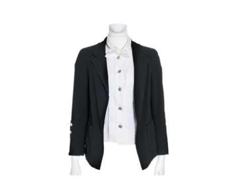 A CHANEL BLACK RAW HEM JACKET
With notched lapels, raw-edge detailing, front patch pockets, and three-button cuffs.
From 2009