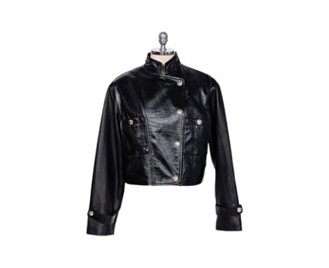 A CHANEL LEATHER BIKER JACKET
Black calfskin exterior, stand collar, gold-tone hardware, patch pockets and button closure
EU 