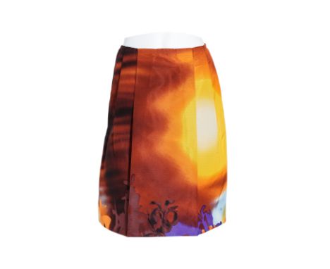 A PRADA GRAPHIC PRINT SKIRT
Mid-length skirt featuring an abstract printed motif in hues of orange, brown, yellow, and purple