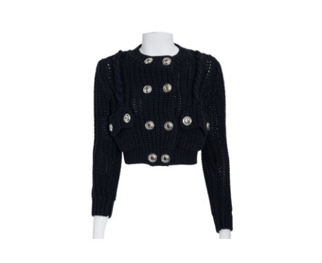 A BURBERRY NAVY CHUNKY CABLE KNIT SWEATER
Cable detailing, silver-toned metal buttons, and ribbed cuffs and hem.
Size XS
Cond