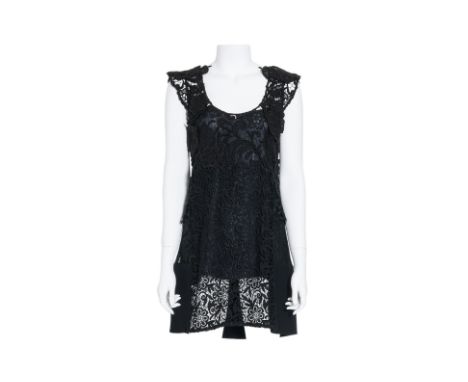 A PRADA GUIPURE BLACK LACE DRESS
Floral lace patchwork dress with round neckline and cap-sleeves
From 2008, Fall/Winter colle