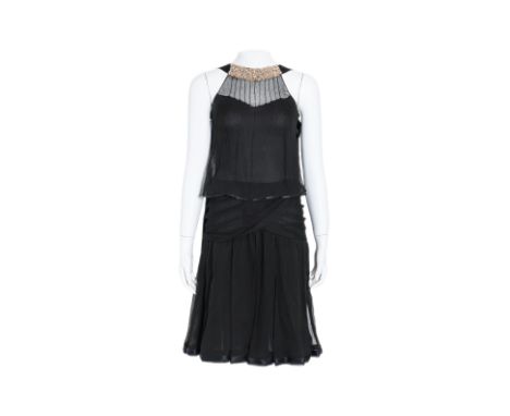 A CHANEL BLACK SLEEVELESS  EVENING DRESS
With a sheer layered bodice, embellished halter neckline, paneled skirt, back button