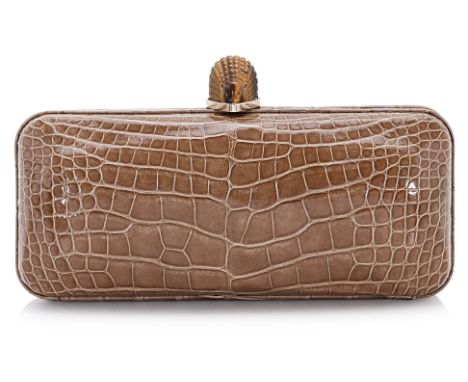 AN ETHAN K CROCODILE LEATHER CLUTCH WITH GEMSTONE CLASP
Greyish-brown leather, with red suede interior, tigers eye gemstone h