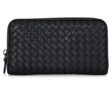 A BOTTEGA VENETA BLACK LEATHER LONG WALLET
Signature Intrecciato weave, zip closure at top, internal zipper compartment, incl