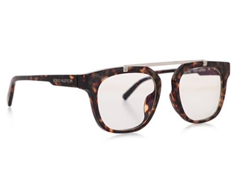 A PAIR OF LOUIS VUITTON SANTAL GLASSES
Tortoiseshell acetate frames with clear lenses, silver-tone top bridge bar, and logo-e