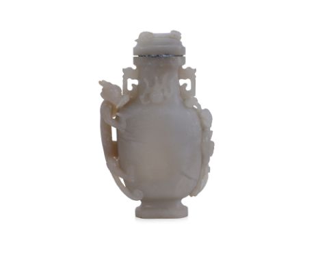 A JADE URN AND COVER Decorated with carved figural dragon, phoenix with ruyi, and chilong to lid 18 x 11 x 3.5cm Condition: C