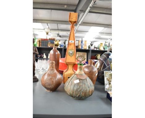 A vintage Italian leather wrapped glass decanter with lion head handles, 56cm, sold together with another leather wrapped dec