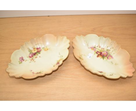 A pair of Royal Worcester 1511 pattern blush ivory porcelain dishes, of shaped oval form with decorated with floral sprays wi
