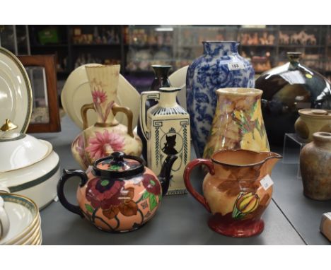 A neo-classical style cream coloured Delf jug, makers mark to base, h20cm, sold together with a hand painted Tuliptime jug, a