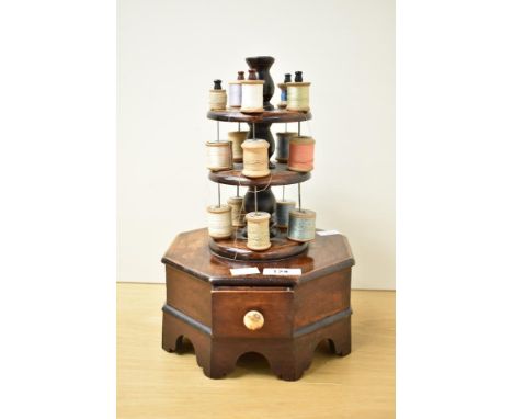A late 19th / early 20th century bobbin stand of octagonal form, h31cm.