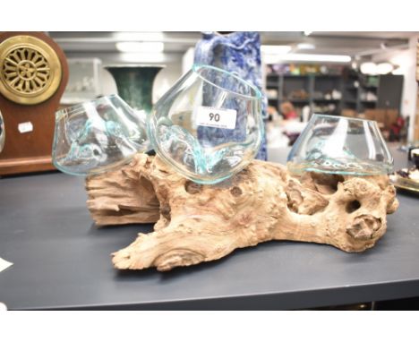 A contemporary Indonesian planter, hand crafted from root wood, with three moulded transparent bowls, 36cm.