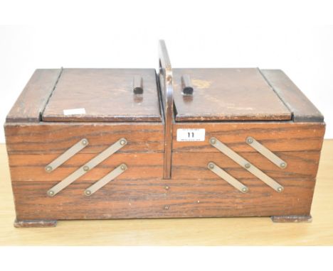 A vintage oak table top concertina sewing box on block feet, 14cm