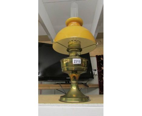 A brass 'Aladdin' oil lamp with shade.